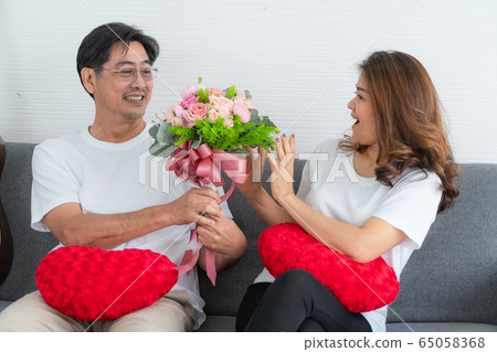 Happy Asian senior people having good time at home 65058368
