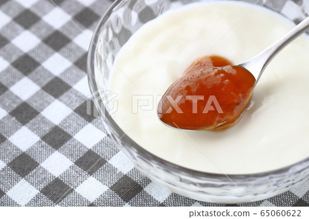 Apricot jam on yogurt 65060622