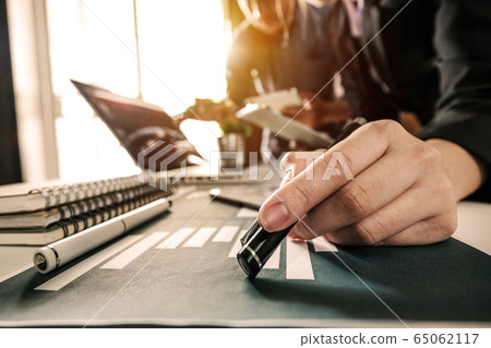 Business team meeting. professional investor working new start up project. Finance task. with smart phone and laptop and digital tablet computer  in morning light 65062117