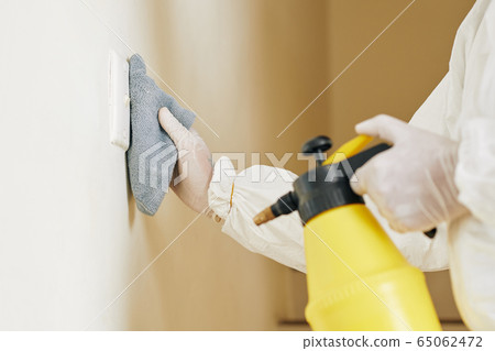 technician wiping switch 65062472