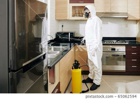 technician cleaning kitchen 65062594