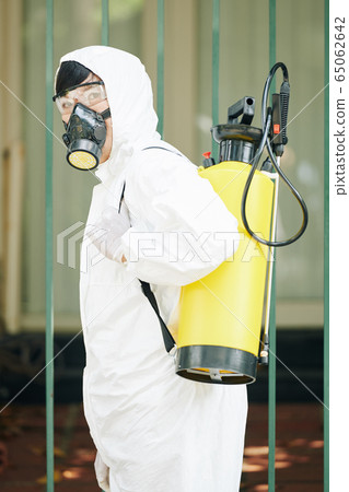 Professional technician in a protective suit 65062642