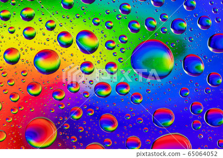 Abstract colorful background with multicolor drops of water on glass. 65064052