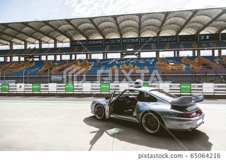 Silver turbocar motion speed test on the stadium 65064216