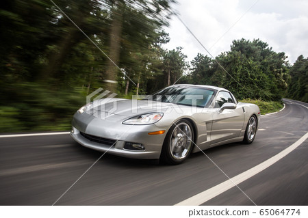 Silver modern cabriolet in the rain forests 65064774