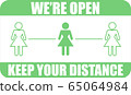 business woman sign come in we are open after quarantine coronavirus COVID-19 65064984