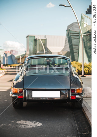 Exterior of a black classic retro car, back lights and baggage Exterior of a black classic retro car, back lights and baggage 65065034
