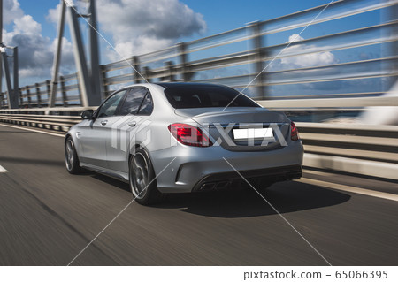 Silver business female sedan test drive over the bridge Silver business female sedan test drive over the bridge 65066395