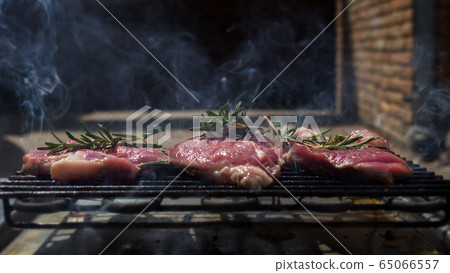 Pork Steaks With Rosemary Grilling on a Hot BBQ Pork Steaks With Rosemary Grilling on a Hot BBQ 65066557