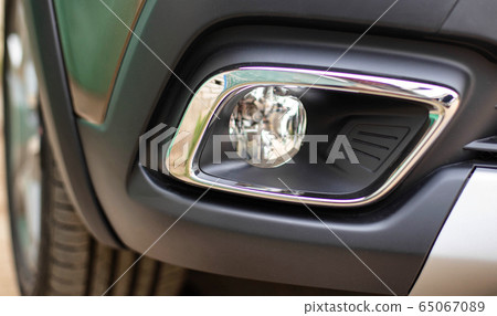 new fog light in a passenger car, background. The concept of good road lighting during fog and poor visibility, headlight 65067089