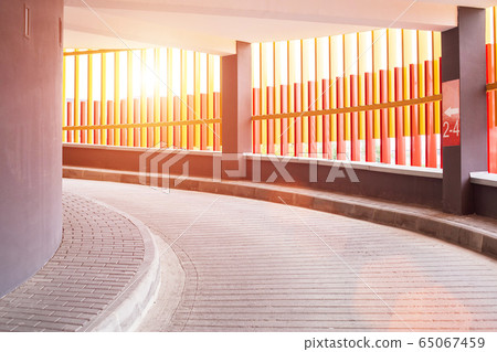 Check-in at the screw parking for cars in the city. Modern parking, sunset, background Check-in at the screw parking for cars in the city. Modern parking, sunset, background 65067459