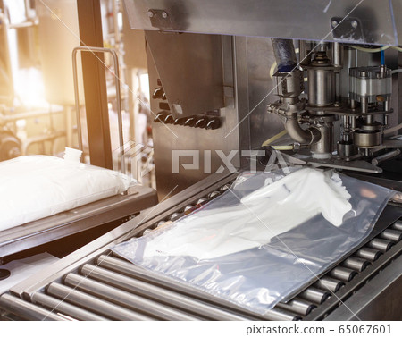 Production and manufacture of milk cream from cow's milk. Automatic, high fat automatic cream filling process, industry, milk product Production and manufacture of milk cream from cow's milk. Automatic, high fat automatic cream filling process, industry, milk product 65067601
