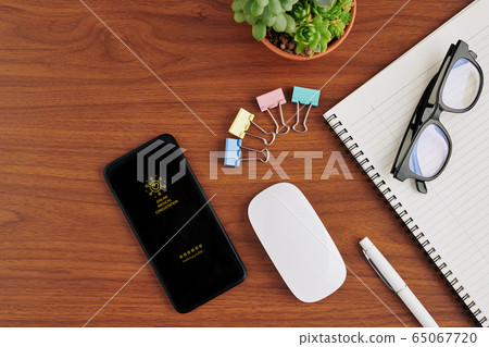 Smartphone with medical app on table 65067720