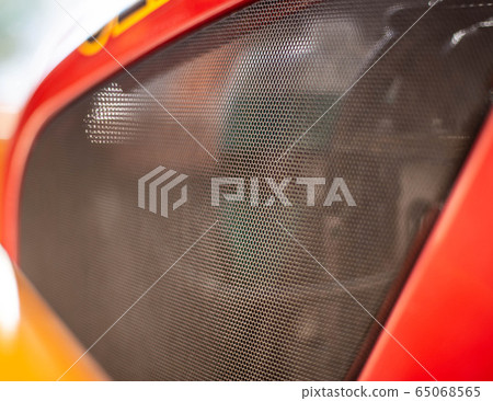 Protective net engine compartment in the car, an element of tuning. Background, copy space, mesh 65068565