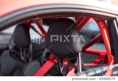 Black seats and red security belts of a car 65068574