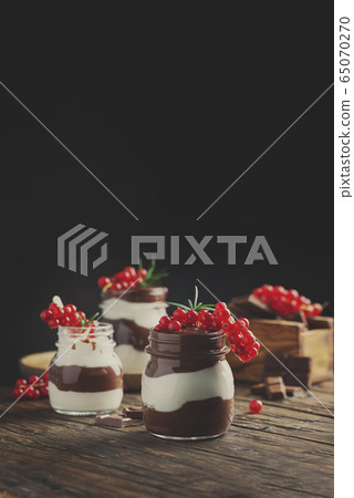 dessert with white and dark chocolate cream dessert with white and dark chocolate cream 65070270