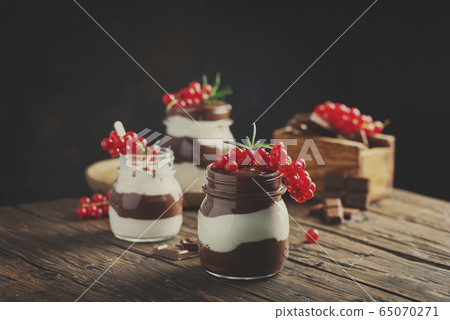 dessert with white and dark chocolate cream dessert with white and dark chocolate cream 65070271