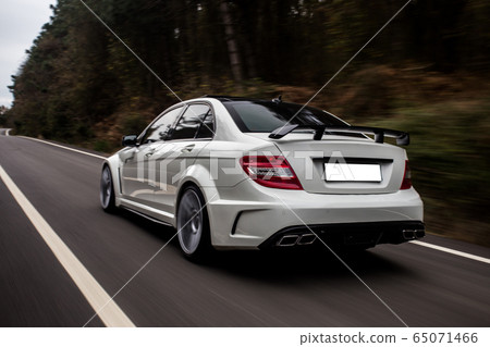 Whitesport sedan on the highway, driving in the nature Whitesport sedan on the highway, driving in the nature 65071466