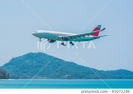 Coronavirus is over. Quarantine weakened. Take off the mask. Now you can travel. Modern airplane in 65072286