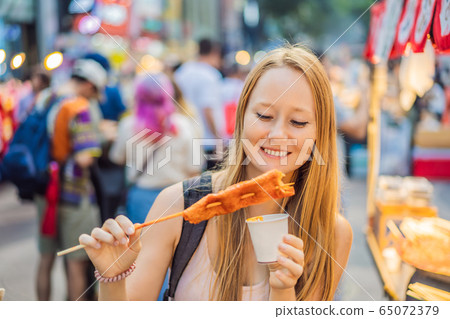 Coronavirus is over. Quarantine weakened. Take off the mask. Now you can travel. Young woman tourist Coronavirus is over. Quarantine weakened. Take off the mask. Now you can travel. Young woman tourist 65072379
