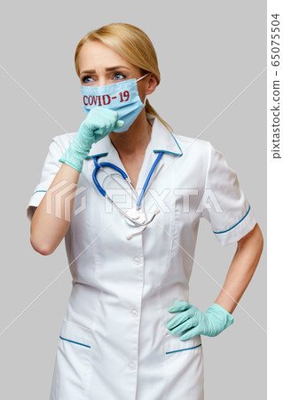 medical doctor nurse woman wearing protective mask and rubber or latex gloves - cough medical doctor nurse woman wearing protective mask and rubber or latex gloves - cough 65075504