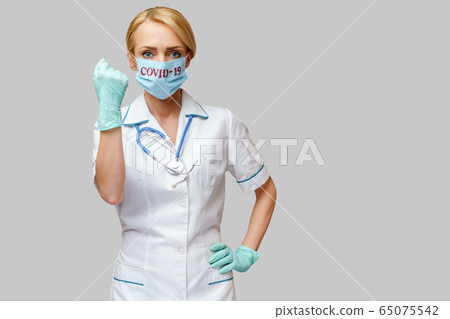 medical doctor nurse woman wearing protective mask and rubber or latex gloves - yes win gesture medical doctor nurse woman wearing protective mask and rubber or latex gloves - yes win gesture 65075542