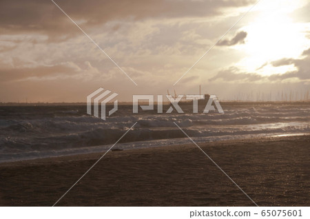 Golden sky in the afternoon with St. Kilda pier at Melbourne Bay Australia 65075601