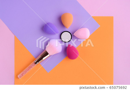 Makeup brush and sponges oncolor background,  65075692