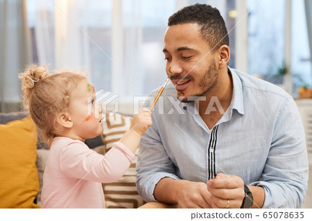 Painting Strokes On Father's Face 65078635