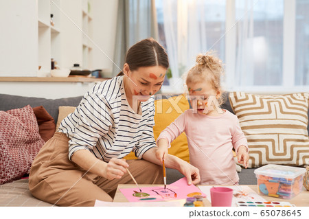 Woman And Girl Painting Together Woman And Girl Painting Together 65078645