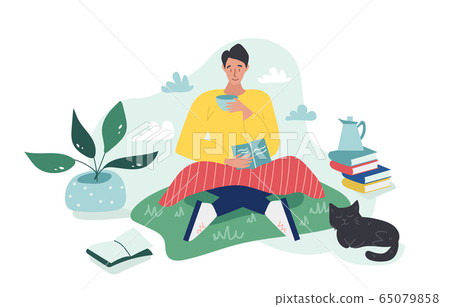 Young boy sitting on the grass with 65079858