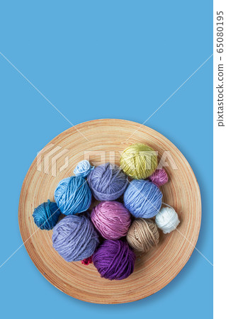 Multicolored woolen balls in bowl. Blue 65080195
