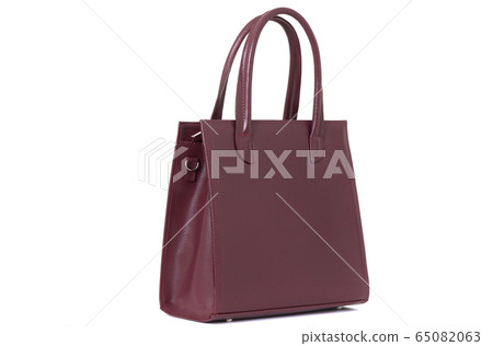 stylish red female leather bag on a handle isolated on a white background stylish red female leather bag on a handle isolated on a white background 65082063