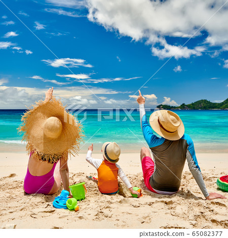 Family with three year old boy on beach Family with three year old boy on beach 65082377
