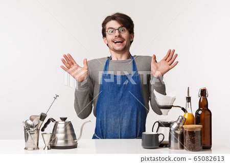Barista, cafe worker and bartender concept. Surprised happy young man in apron, gasping amused and smiling cheerful camera clasp hands excited, standing over coffee counter, white background Barista, cafe worker and bartender concept. Surprised happy young man in apron, gasping amused and smiling cheerful camera clasp hands excited, standing over coffee counter, white background 65082613
