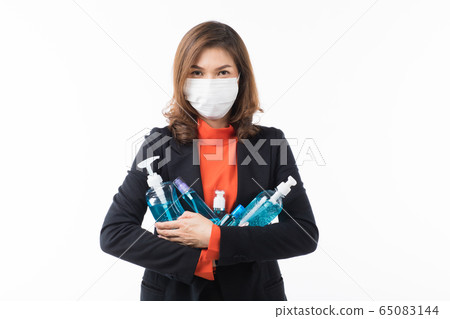 Woman holding many kinds of hand wash gel. 65083144