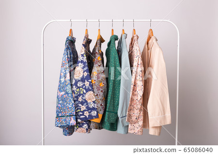Clothing retails concept. Ladies pajamas on hangers in clothes store. Pajama in shop. Advertise, sale, fashion and shopping concept. Clothing retails concept. Ladies pajamas on hangers in clothes store. Pajama in shop. Advertise, sale, fashion and shopping concept. 65086040