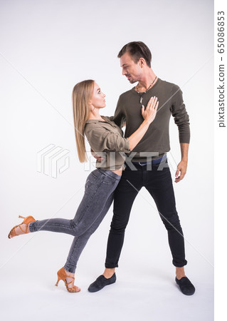 Salsa, kizomba and bachata dancers on white background. Social dance concept. Salsa, kizomba and bachata dancers on white background. Social dance concept. 65086853