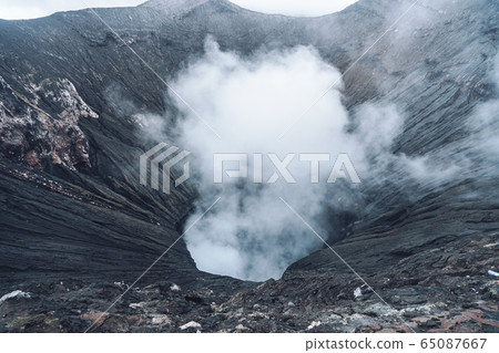Photo of smoke volcano crater on Java island 65087667