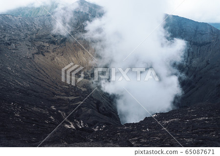 Photo of smoke volcano crater on Java island 65087671