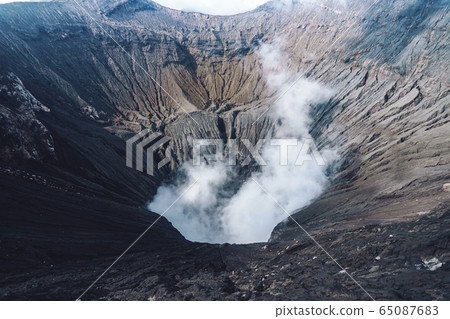 Photo of smoke volcano crater on Java island 65087683