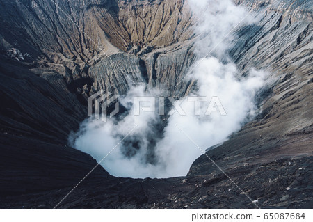 Photo of smoke volcano crater on Java island Photo of smoke volcano crater on Java island 65087684