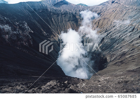 Photo of smoke volcano crater on Java island Photo of smoke volcano crater on Java island 65087685
