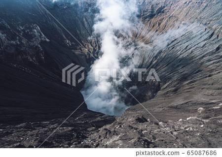 Photo of smoke volcano crater on Java island 65087686