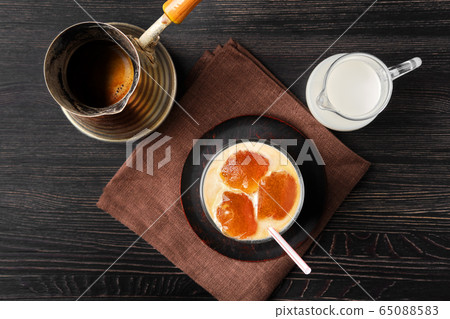 Top view of iced latte with frozen coffee cubes and sweet cream Top view of iced latte with frozen coffee cubes and sweet cream 65088583