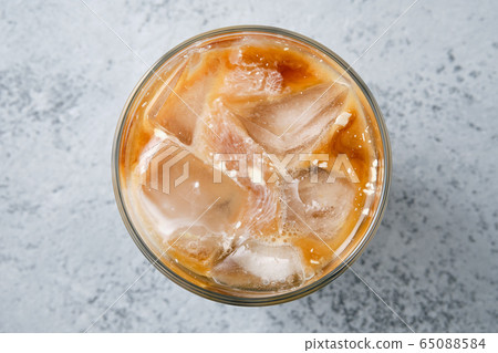 Top view of iced coffee with fat cream in rocks glass Top view of iced coffee with fat cream in rocks glass 65088584