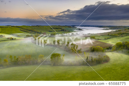 Lush green River valley Tuscany Lush green River valley Tuscany 65088775