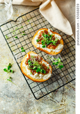 Canape or crostini with toasted baguette, cottage 65088859