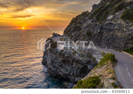 Winding road along rocky coast Winding road along rocky coast 65089011