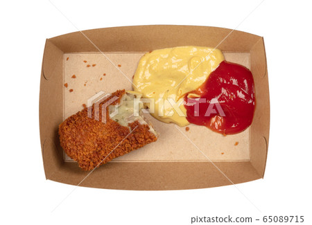 Partly eaten brown crusty dutch kroket with 65089715